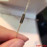 Side view of Van Cleef & Arpels unisex jewelry piece