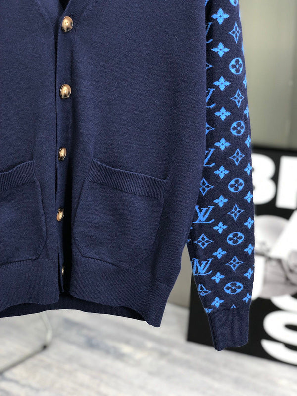 Flat lay presentation of Louis Vuitton luxury clothing with signature branding