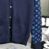 Flat lay presentation of Louis Vuitton luxury clothing with signature branding