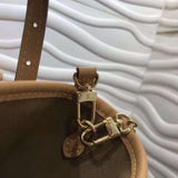Side profile of premium structured women's handbag – women's luxury accessory