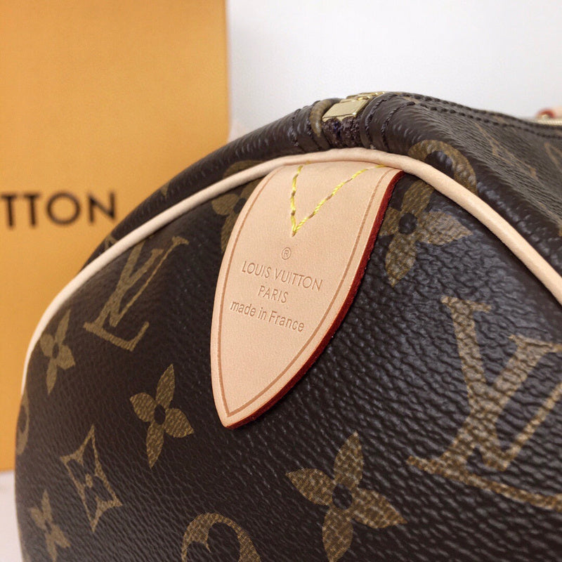 Handle and strap detail of signature polished women's handbag – women's luxury handbag