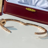 Side view of Cartier unisex jewelry piece