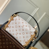  Signature handbag carried on shoulder