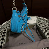 Styled lifestyle shot of elevated modern women's handbag – women's luxury accessory