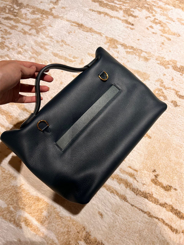Side view of understated structured handbag