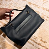 Side view of understated structured handbag
