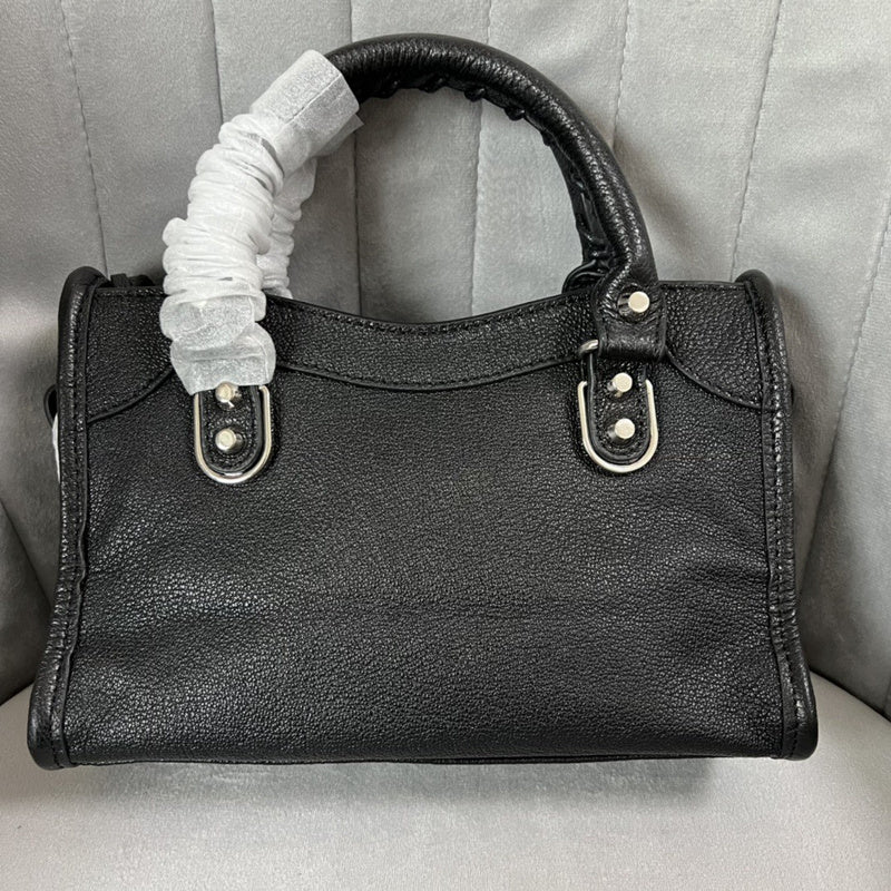 Zivas Charm Understated Luxury Statement Handbag (Signature Shape & Finish) – Lifestyle Shot