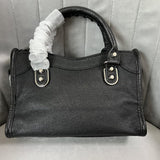 Zivas Charm Understated Luxury Statement Handbag (Signature Shape & Finish) – Lifestyle Shot