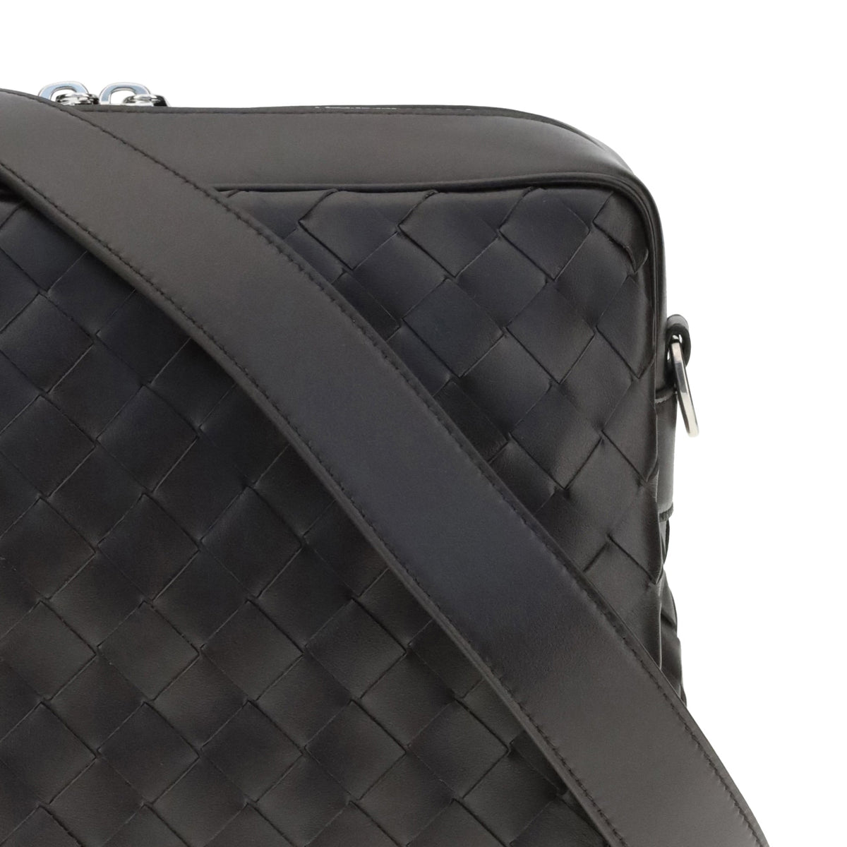 Close-up of Bottega Veneta cross body bags hardware and fine stitching
