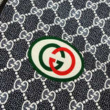 Close-up detail shot of Gucci luxury clothing with logo-detail design
