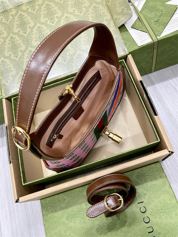 Styled lifestyle shot of sleek signature women's handbag – women's premium purse
