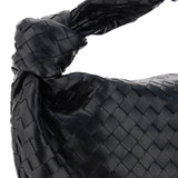 Close-up of Bottega Veneta shoulder bags hardware and fine stitching