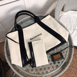 Handle and strap detail of refined modern women's handbag – women's luxury accessory