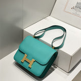 Side view of streamlined structured handbag