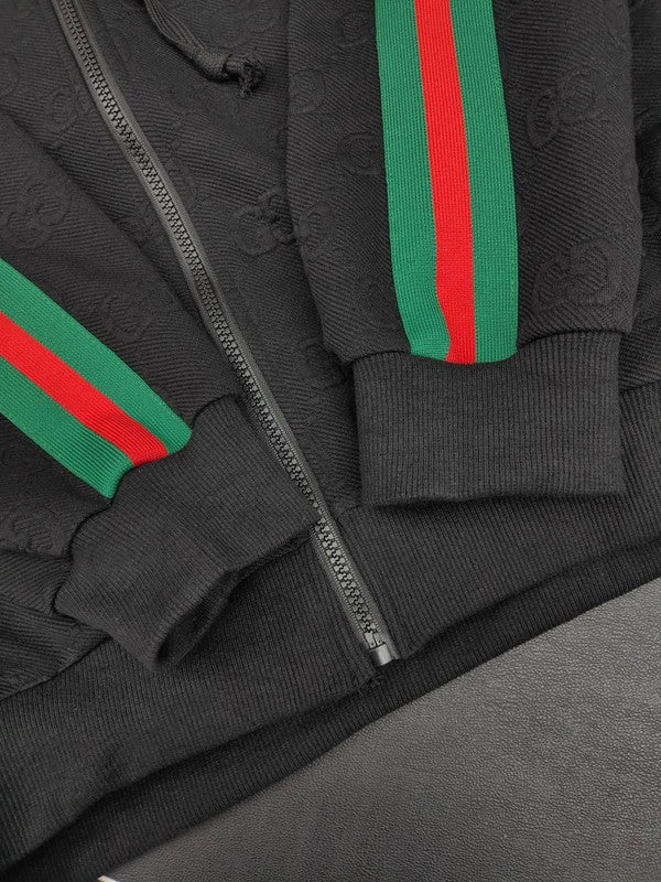 Flat lay presentation of Gucci luxury clothing with label-forward styling