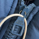 Flat lay presentation of Louis Vuitton luxury clothing with logo-detail design