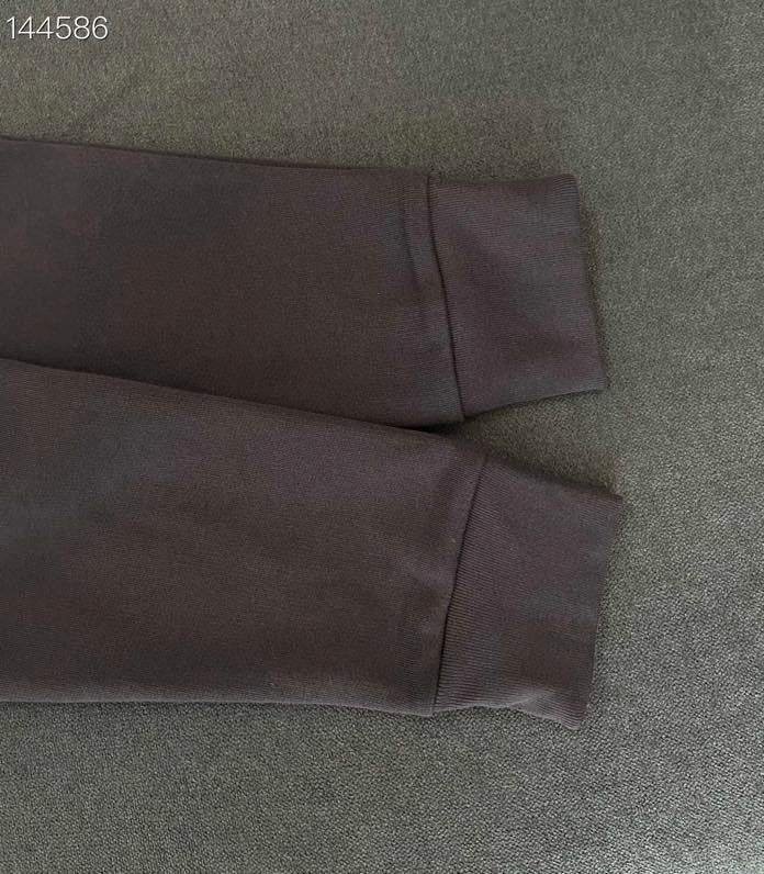 Close-up detail shot of Louis Vuitton luxury clothing with everyday silhouette