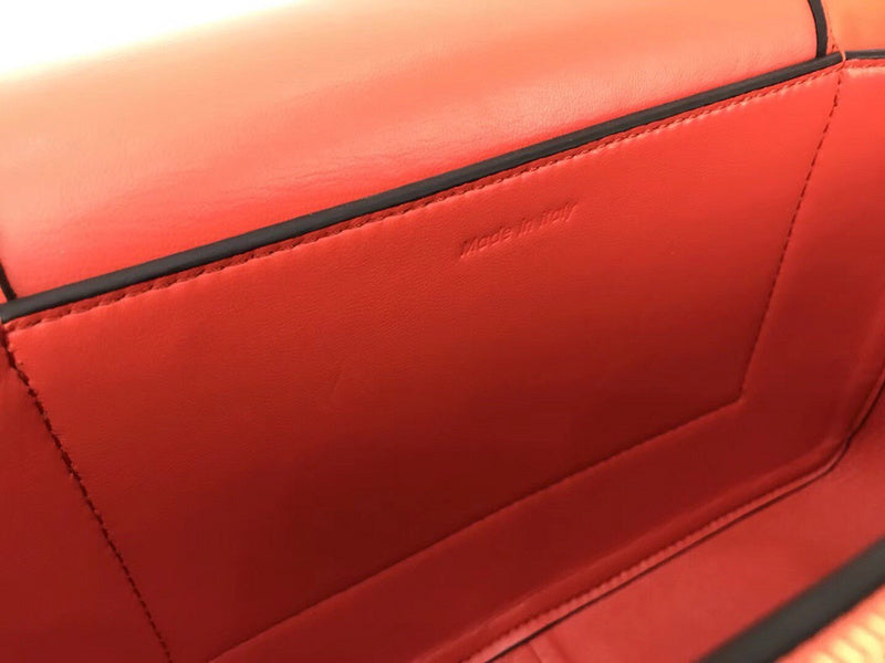 Side profile of classic polished women's handbag – women's luxury accessory