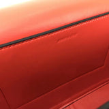 Side profile of classic polished women's handbag – women's luxury accessory