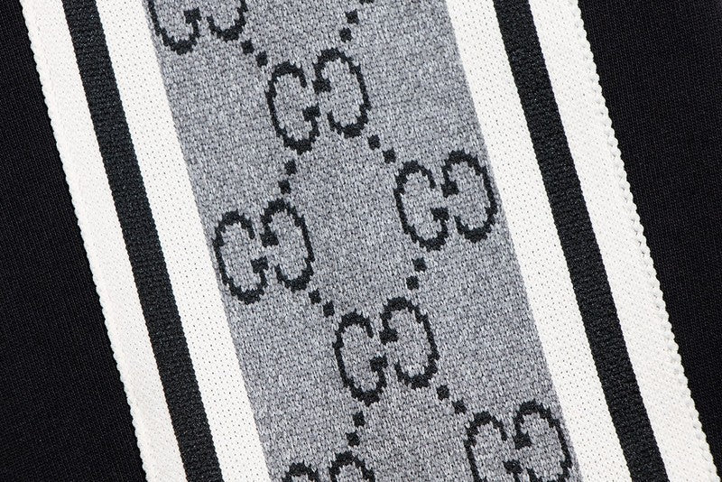 Flat lay presentation of Gucci luxury clothing with tailored silhouette