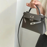 Side view of understated structured handbag