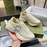 Side profile of Gucci classic monochrome sneakers retro runner design