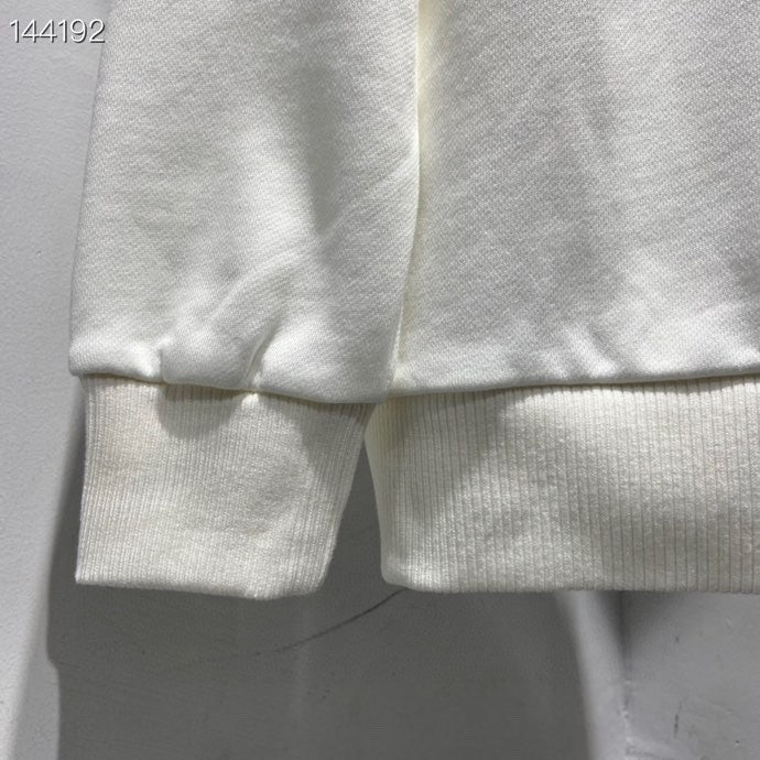 Close-up detail shot of Louis Vuitton luxury clothing with everyday silhouette