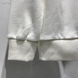 Close-up detail shot of Louis Vuitton luxury clothing with everyday silhouette