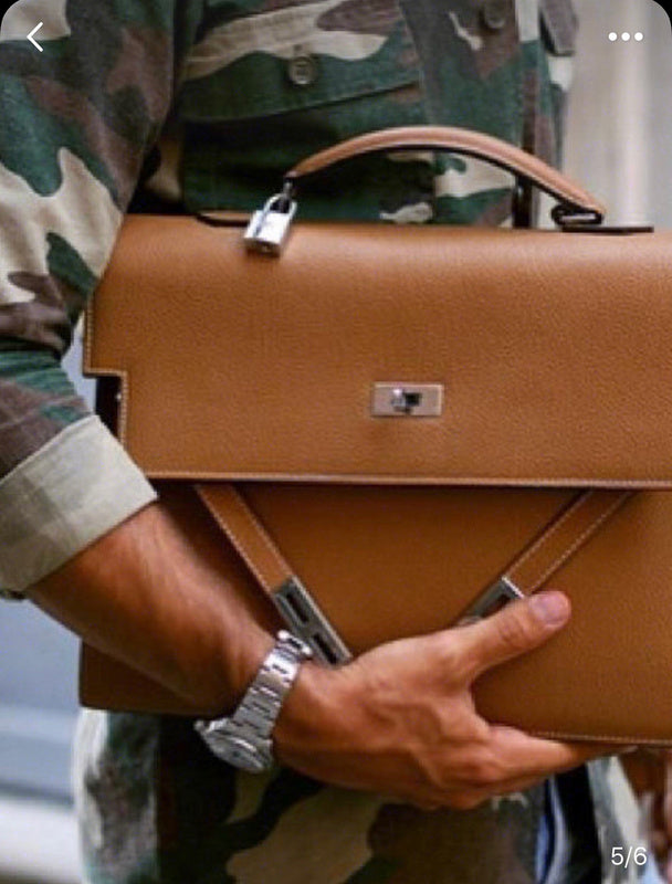 Side view of poised structured handbag