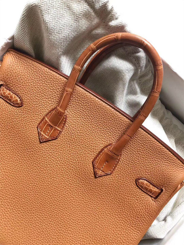 Signature tote bag carried on shoulder