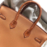  Signature tote bag carried on shoulder