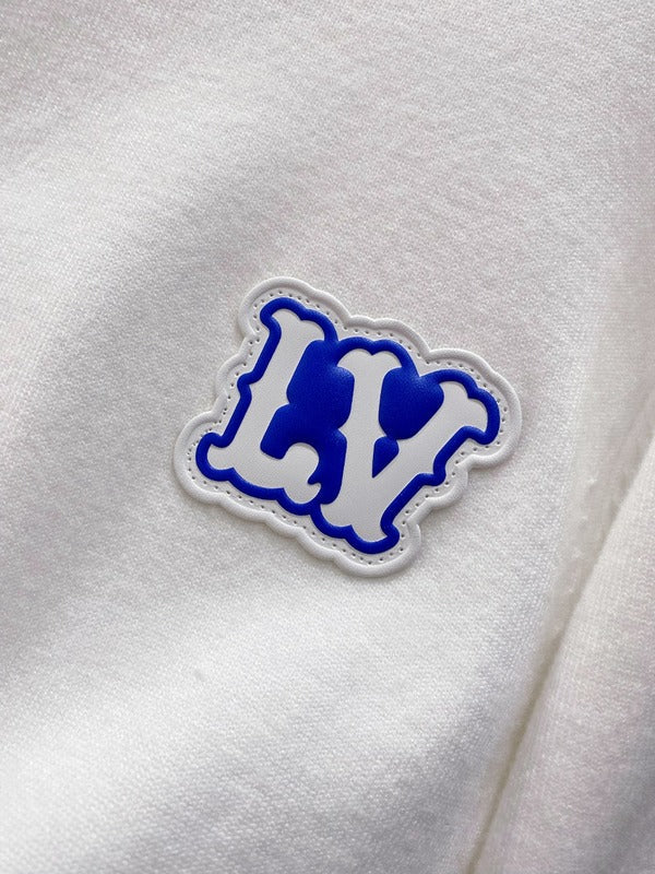 Flat lay presentation of Louis Vuitton luxury clothing with streetwear-inspired cut