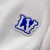 Flat lay presentation of Louis Vuitton luxury clothing with streetwear-inspired cut