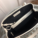 Side profile of chic everyday-luxe women's handbag – women's luxury handbag