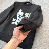 Close-up detail shot of Louis Vuitton luxury clothing with signature branding