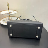 Side view of effortless structured handbag