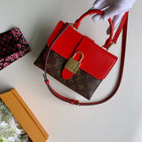 Styled lifestyle shot of structured signature women's handbag – women's designer-style accessory