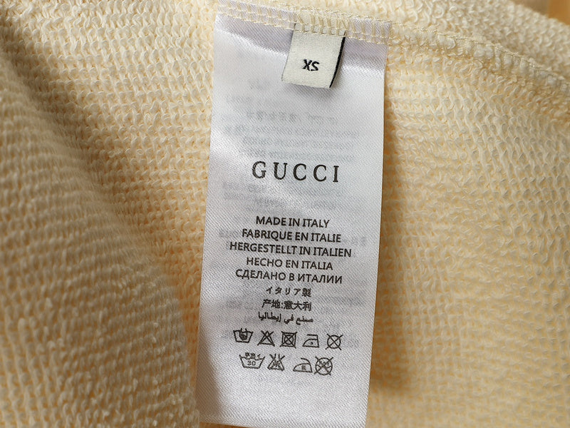 Close-up detail shot of Gucci luxury clothing with tailored silhouette