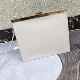 Styled lifestyle shot of refined modern women's handbag – women's luxury handbag