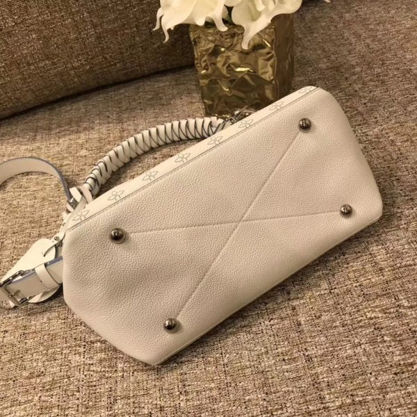 Styled lifestyle shot of classic refined women's handbag – women's luxury handbag