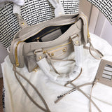 Close-up detail of polished classic women's handbag – women's luxury accessory