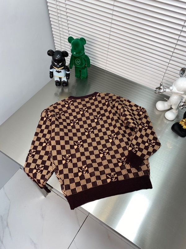 Flat lay presentation of Louis Vuitton luxury clothing with monogram-inspired silhouette
