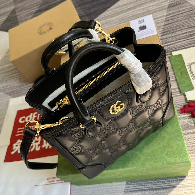 Front view of signature polished women's handbag – women's luxury handbag
