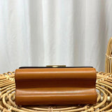Styled lifestyle shot of chic polished women's handbag – women's luxury handbag