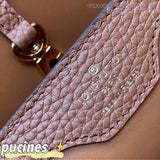 Side profile of signature statement women's handbag – women's everyday handbag