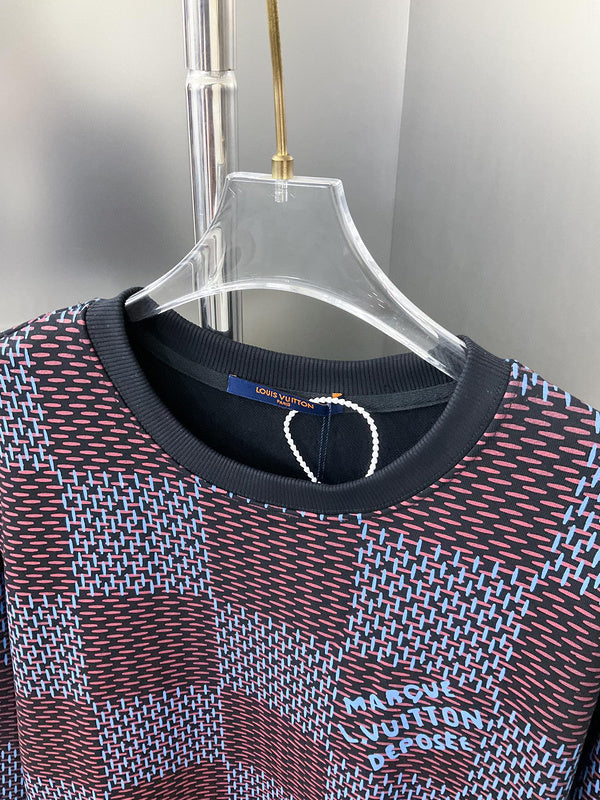 Close-up detail shot of Louis Vuitton luxury clothing with label-forward styling