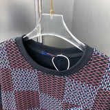 Close-up detail shot of Louis Vuitton luxury clothing with label-forward styling