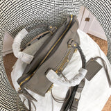 Styled lifestyle shot of sleek polished women's handbag – women's luxury accessory