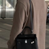  timeless top-handle bag detail view showing craftsmanship
