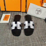 Hermès Tan Flat Thong Sandals - Close-Up Texture View